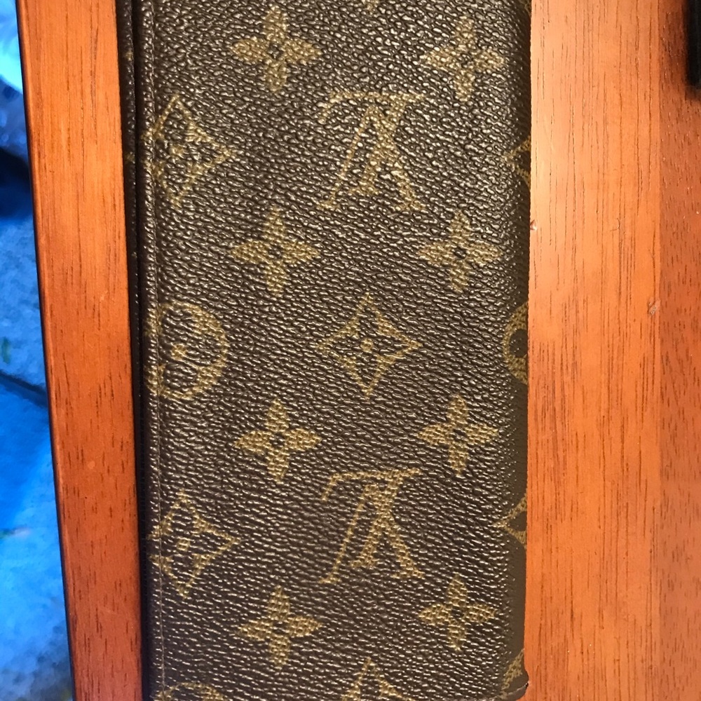 L V check book cover